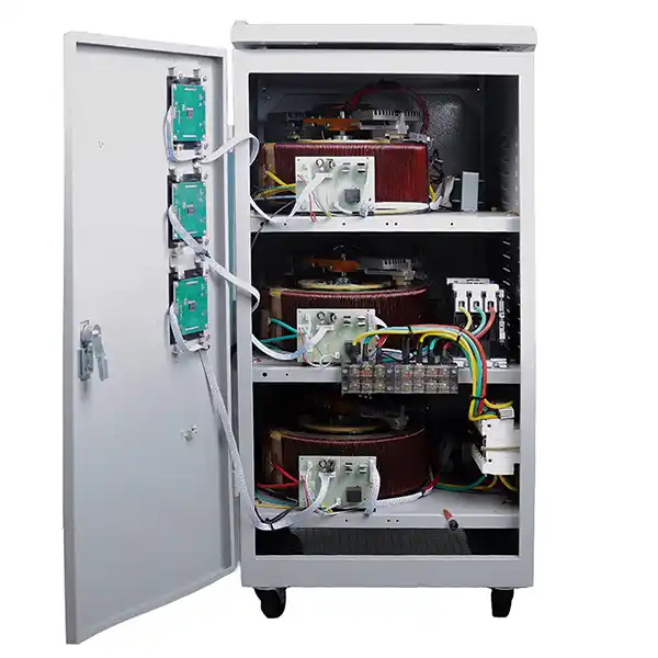 Internal components of a servo voltage stabilizer showing carbon brush, servo motor, and autotransformer windings